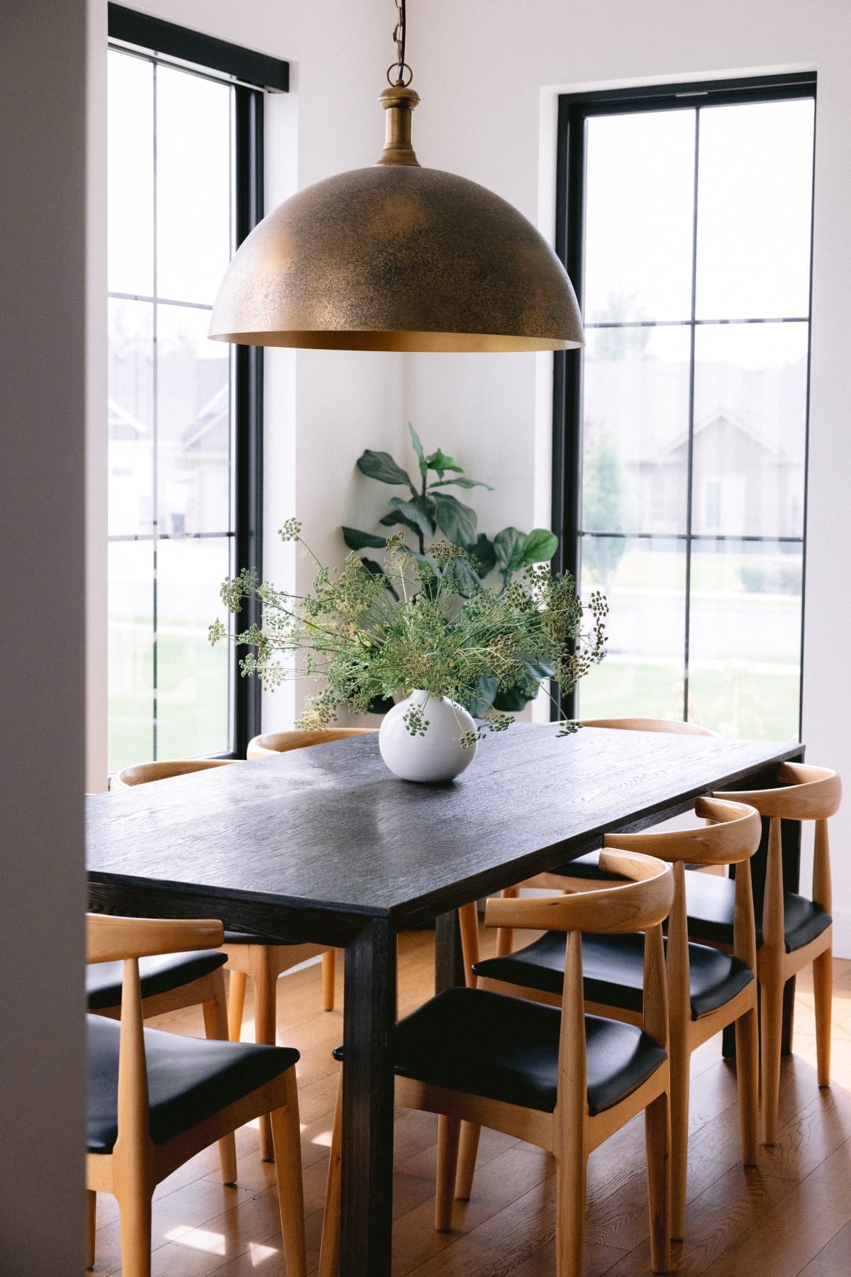 Dining room with a black table and mid-century chairs