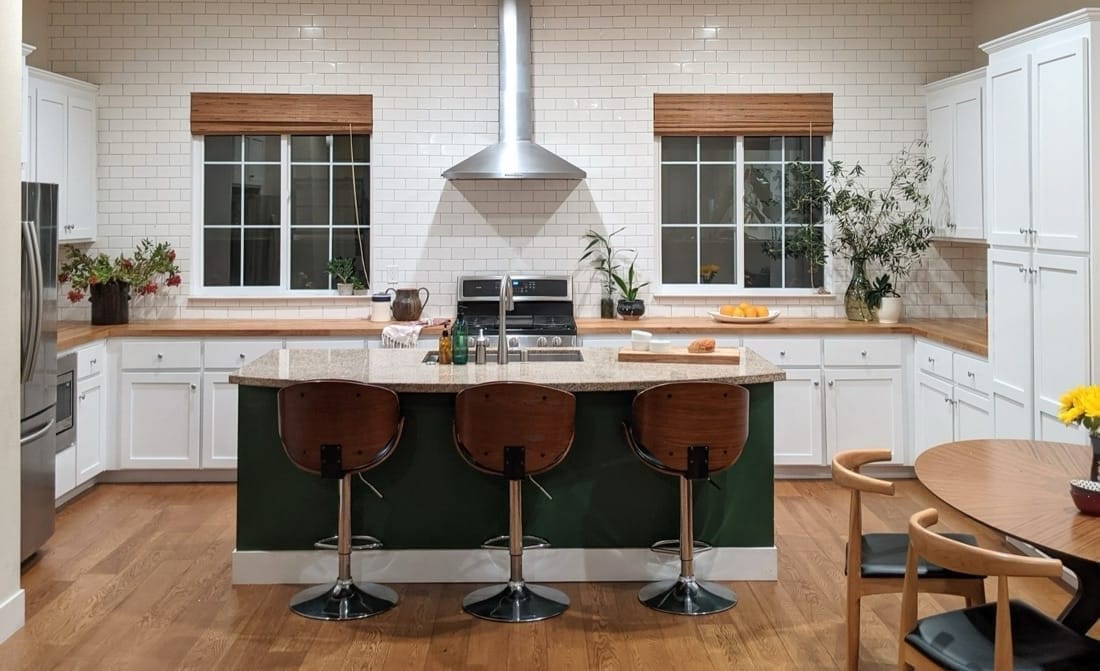 Sunnyvale Townhouse: kitchen with a green island, subway tile and range hood