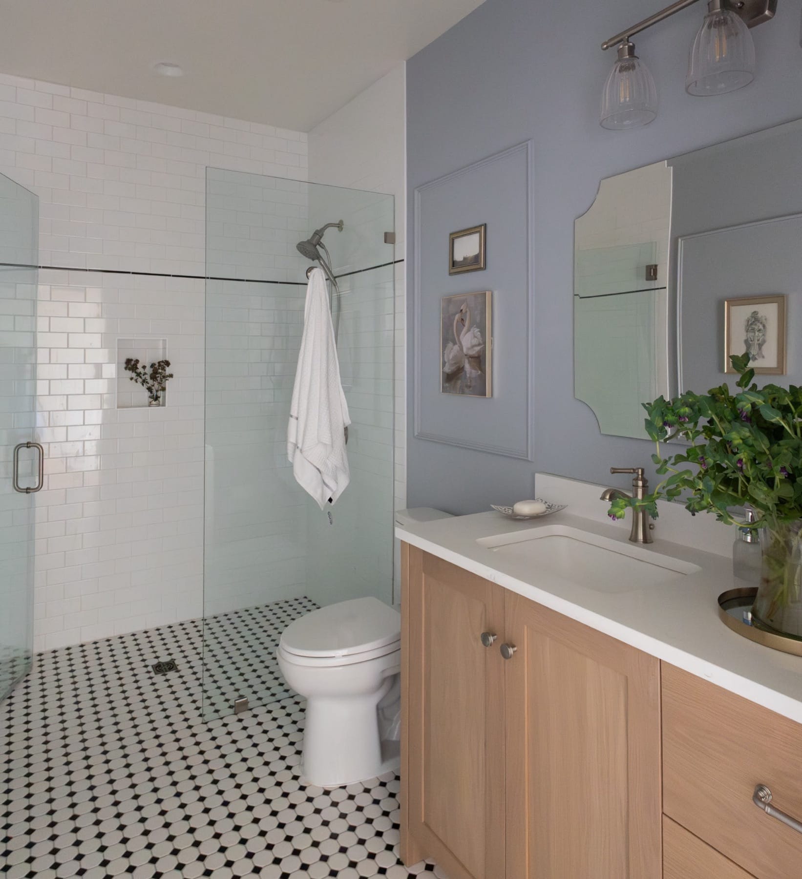 Guest bathroom vanity and shower with blue-gray walls