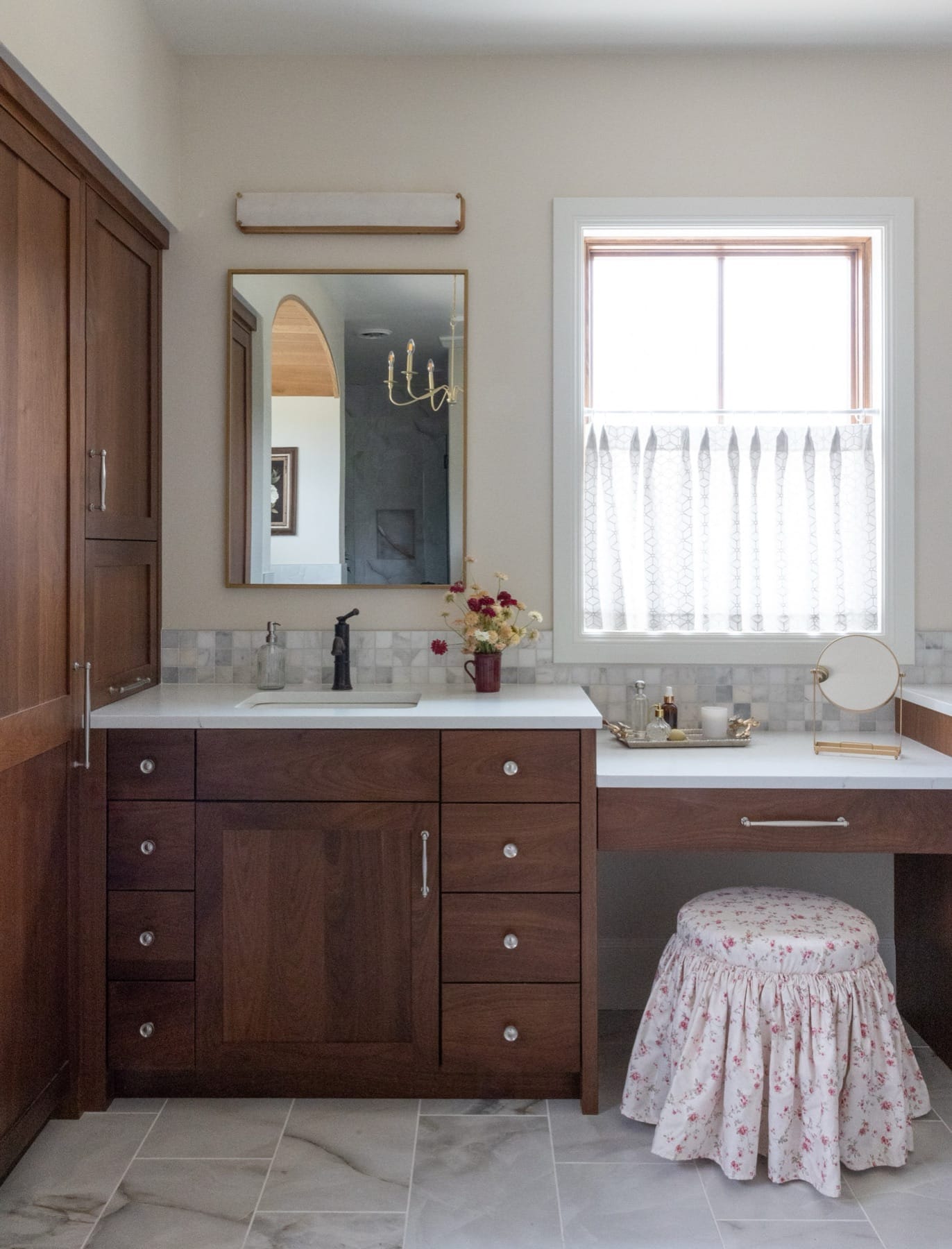 Primary bathroom double vanity with framed mirrors