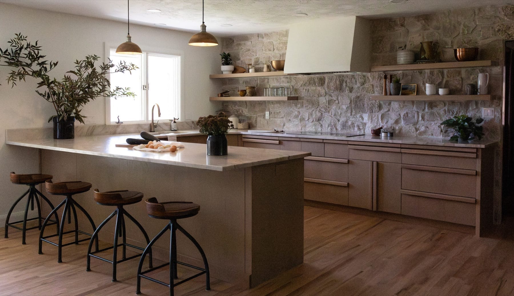 Kitchen island and open shelving in a farmhouse-style kitchen