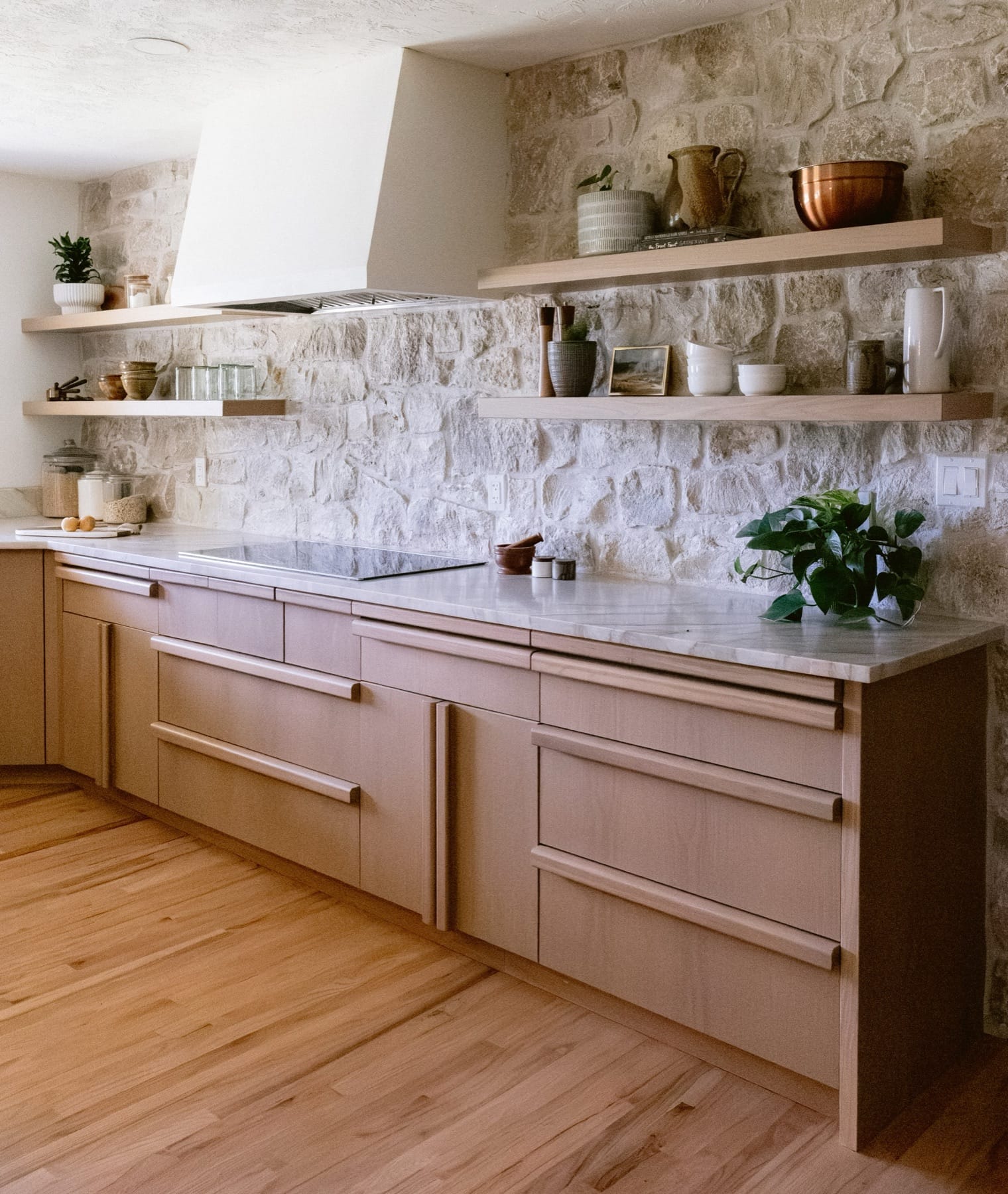 Wood cabinetry, stone backsplash and open shelves in the Farmhouse Kitchen